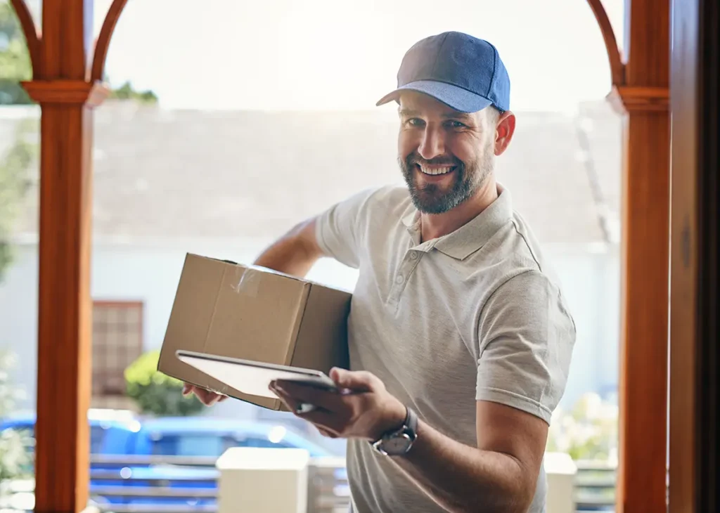 A delivery man with a parcel offering the best shipping services for ecommerce.