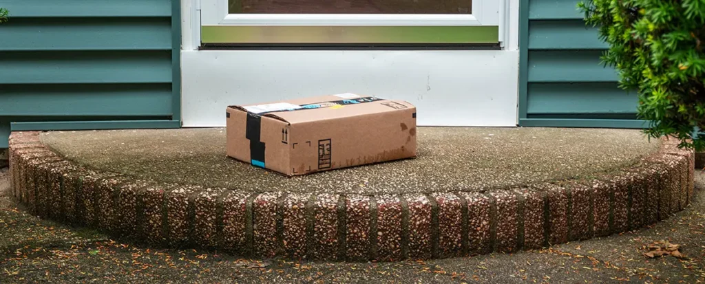 Wet parcel on a doorstep is protected by ecommerce shipping insurance.