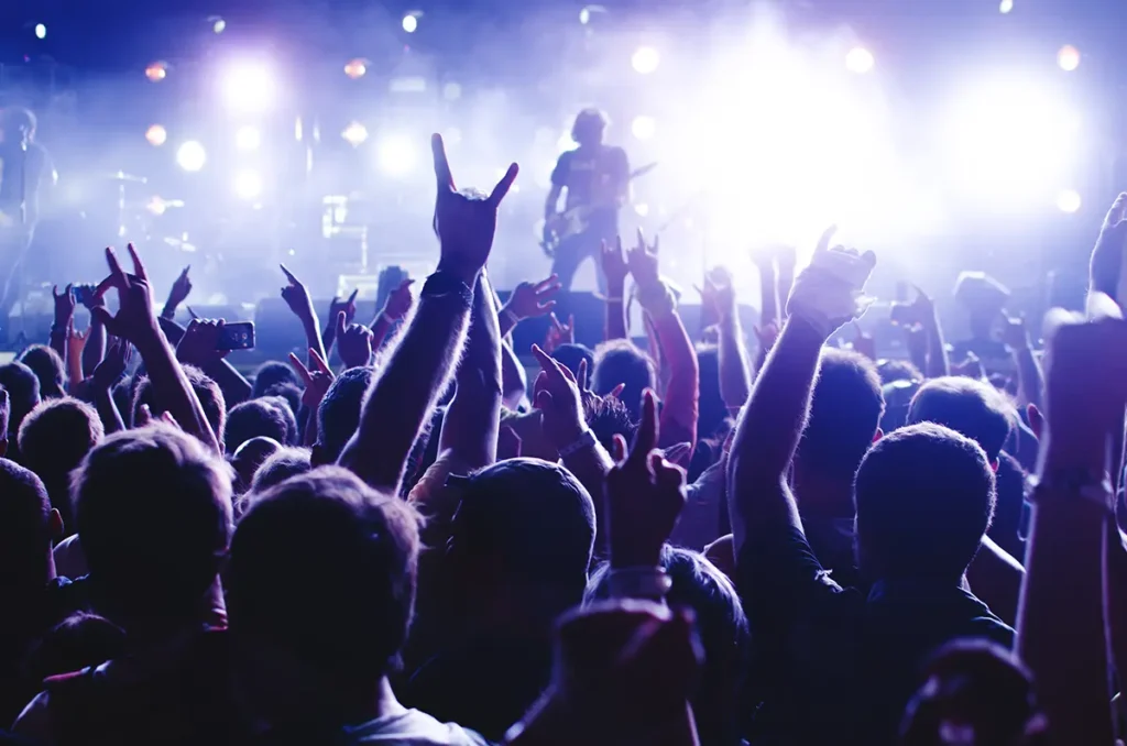 Rock concert with a guitarist on stage representing how ecommerce shipping is like a rock concert where sound equipment works correctly